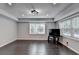 Living room with dark hardwood flooring, recessed lighting, and large windows at 168 Woodland Valley Rd, Lawrenceville, GA 30046