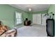 Green office space with shelving, desk, and natural light at 168 Woodland Valley Rd, Lawrenceville, GA 30046