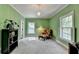 Bright home office with green walls, and windows with natural light at 168 Woodland Valley Rd, Lawrenceville, GA 30046