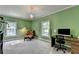 Office with green walls, neutral carpet, chandelier, and comfortable chair at 168 Woodland Valley Rd, Lawrenceville, GA 30046