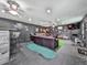 Finished basement featuring dark walls, leather furniture, and putting green accent at 2660 Birch Se St, Smyrna, GA 30080