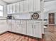 Kitchen with white cabinetry, granite countertops, subway tile backsplash, and stainless steel appliances at 2660 Birch Se St, Smyrna, GA 30080