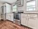 Modern kitchen featuring stainless steel appliances, granite countertops, and white subway tile at 2660 Birch Se St, Smyrna, GA 30080