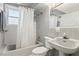 Bathroom with vintage tile, shower-tub, pedestal sink, and new fixtures at 3250 North Embry Cir, Chamblee, GA 30341