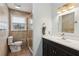 Bathroom featuring tiled walls, glass-enclosed shower, and a dark vanity at 3250 North Embry Cir, Chamblee, GA 30341