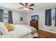 Bedroom with TV, hardwood floors and windows with patterned curtains at 3250 North Embry Cir, Chamblee, GA 30341