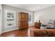 Cozy living room featuring two windows, a wood armoire and a comfortable chair at 3250 North Embry Cir, Chamblee, GA 30341