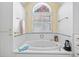 Cozy bathroom showcasing a garden tub and a bright, airy feel at 357 Breeze Hill Ln, Canton, GA 30114