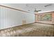 Spacious bedroom with large windows, patterned wallpaper, and a ceiling fan at 357 Breeze Hill Ln, Canton, GA 30114