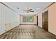 Bedroom featuring a large window with outdoor views, ceiling fan, and double door closet at 357 Breeze Hill Ln, Canton, GA 30114