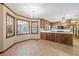 Dining area featuring tile flooring, natural light, breakfast nook, and access to other living spaces at 357 Breeze Hill Ln, Canton, GA 30114