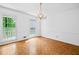 Bright dining room featuring a chandelier and hardwood floors at 357 Breeze Hill Ln, Canton, GA 30114