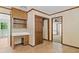 Dining area featuring tile flooring, built-in desk, and seamless access to other living spaces at 357 Breeze Hill Ln, Canton, GA 30114