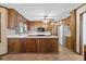 Kitchen featuring wood cabinets, appliances, countertop space, and an open layout at 357 Breeze Hill Ln, Canton, GA 30114