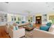 Staged living room with fireplace, built-in shelving and hardwood floors at 357 Breeze Hill Ln, Canton, GA 30114