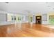 Bright, spacious living room featuring hardwood floors, fireplace, and built in shelving at 357 Breeze Hill Ln, Canton, GA 30114