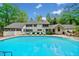 A gorgeous backyard pool is surrounded by lush foliage and has plenty of room for chairs at 357 Breeze Hill Ln, Canton, GA 30114