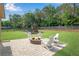 Spacious backyard with a playset and a fire pit area, great for outdoor activities at 4285 Hunters Walk Way, Cumming, GA 30028