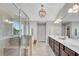 Bright bathroom with glass shower, soaking tub, and dual sink vanity at 4285 Hunters Walk Way, Cumming, GA 30028