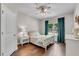 Cozy bedroom with hardwood floors, neutral paint, and large window overlooking the yard at 4285 Hunters Walk Way, Cumming, GA 30028