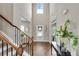 Elegant entryway with hardwood floors, soaring ceilings, and decorative lighting at 4285 Hunters Walk Way, Cumming, GA 30028