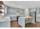 Beautiful kitchen with an island, light-colored cabinets, stainless appliances, and hardwood flooring at 4285 Hunters Walk Way, Cumming, GA 30028