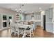 Eat in kitchen with bright cabinets, stainless appliances, and a view of the backyard at 4285 Hunters Walk Way, Cumming, GA 30028