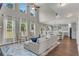 Bright and airy living room with high ceilings, large windows, and an open layout at 4285 Hunters Walk Way, Cumming, GA 30028