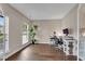 Bright home office with hardwood floors, ample desk space, and a tranquil view at 4285 Hunters Walk Way, Cumming, GA 30028