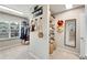 Walk-in closet boasts mirror, window, shelving, and hanging storage at 4285 Hunters Walk Way, Cumming, GA 30028