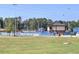 Baseball field view with green outfield, stadium seating, and trees in the background at 2249 Hill Creek Way, Marietta, GA 30062