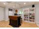 Finished basement area features a small island, shelving, and a convenient kitchenette at 2249 Hill Creek Way, Marietta, GA 30062
