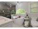 Spa-like primary bathroom with a soaking tub, walk-in shower, and modern fixtures at 2249 Hill Creek Way, Marietta, GA 30062