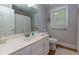 Clean bathroom features a white vanity, updated fixtures, and modern lighting at 2249 Hill Creek Way, Marietta, GA 30062