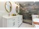 Bright bathroom features double vanity, sleek tiled shower, and luxurious soaking tub at 2249 Hill Creek Way, Marietta, GA 30062
