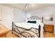 Comfortable bedroom with black iron bed frame, matching nightstand, and natural lighting at 2249 Hill Creek Way, Marietta, GA 30062
