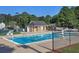 Community pool area with seating, landscaping, and bathhouse at 2249 Hill Creek Way, Marietta, GA 30062