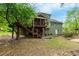 Exterior view of the home showing the back deck and private wooded backyard at 2249 Hill Creek Way, Marietta, GA 30062