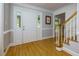 Bright foyer featuring hardwood floors, a staircase, and a white front door, creating a grand entrance at 2249 Hill Creek Way, Marietta, GA 30062
