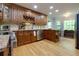 Gourmet kitchen with stainless steel appliances, granite counters, and custom wood cabinets at 2249 Hill Creek Way, Marietta, GA 30062