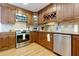 Charming kitchen featuring custom cabinets, stainless steel appliances and granite countertops at 2249 Hill Creek Way, Marietta, GA 30062