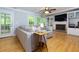 Cozy living room with hardwood floors, fireplace, built-in shelves, and a comfortable sectional sofa at 2249 Hill Creek Way, Marietta, GA 30062