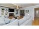 Open living room with hardwood floors, fireplace, and views into the dining room and front entrance at 2249 Hill Creek Way, Marietta, GA 30062