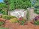 Stone community sign with 'Heritage Trace' inscription amidst colorful landscaping at 2249 Hill Creek Way, Marietta, GA 30062
