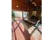 Beautiful outdoor deck area with dining table, bench seating, overhead fan, and covered wood ceiling at 2249 Hill Creek Way, Marietta, GA 30062