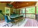Cozy outdoor patio with dining table, ceiling fan, and wood ceiling overlooking the yard at 2249 Hill Creek Way, Marietta, GA 30062