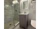 Bathroom features a glass shower, vanity and mirror at 2463 Briarmoor Ne Rd, Atlanta, GA 30345