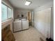 Laundry room features a washer, dryer, shelving and folding doors at 2463 Briarmoor Ne Rd, Atlanta, GA 30345
