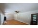 Bright living room features light-colored walls, ceiling fan, and entry doorway at 2463 Briarmoor Ne Rd, Atlanta, GA 30345