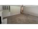 Open-concept living room featuring built-in shelving, a brick wall, and a view of the dining area at 2463 Briarmoor Ne Rd, Atlanta, GA 30345